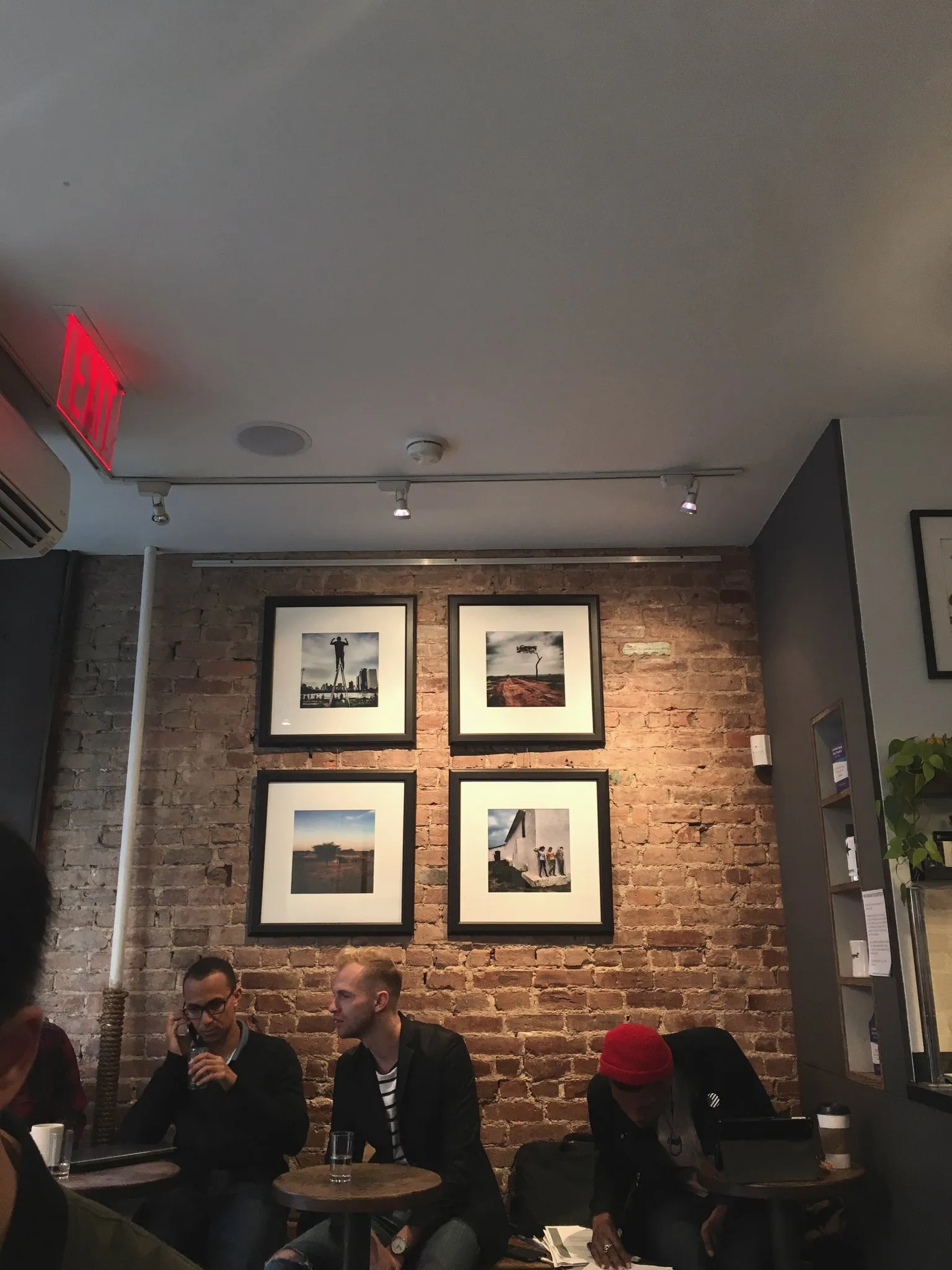 Cafe interior with exposed brick walls and a coffee bar