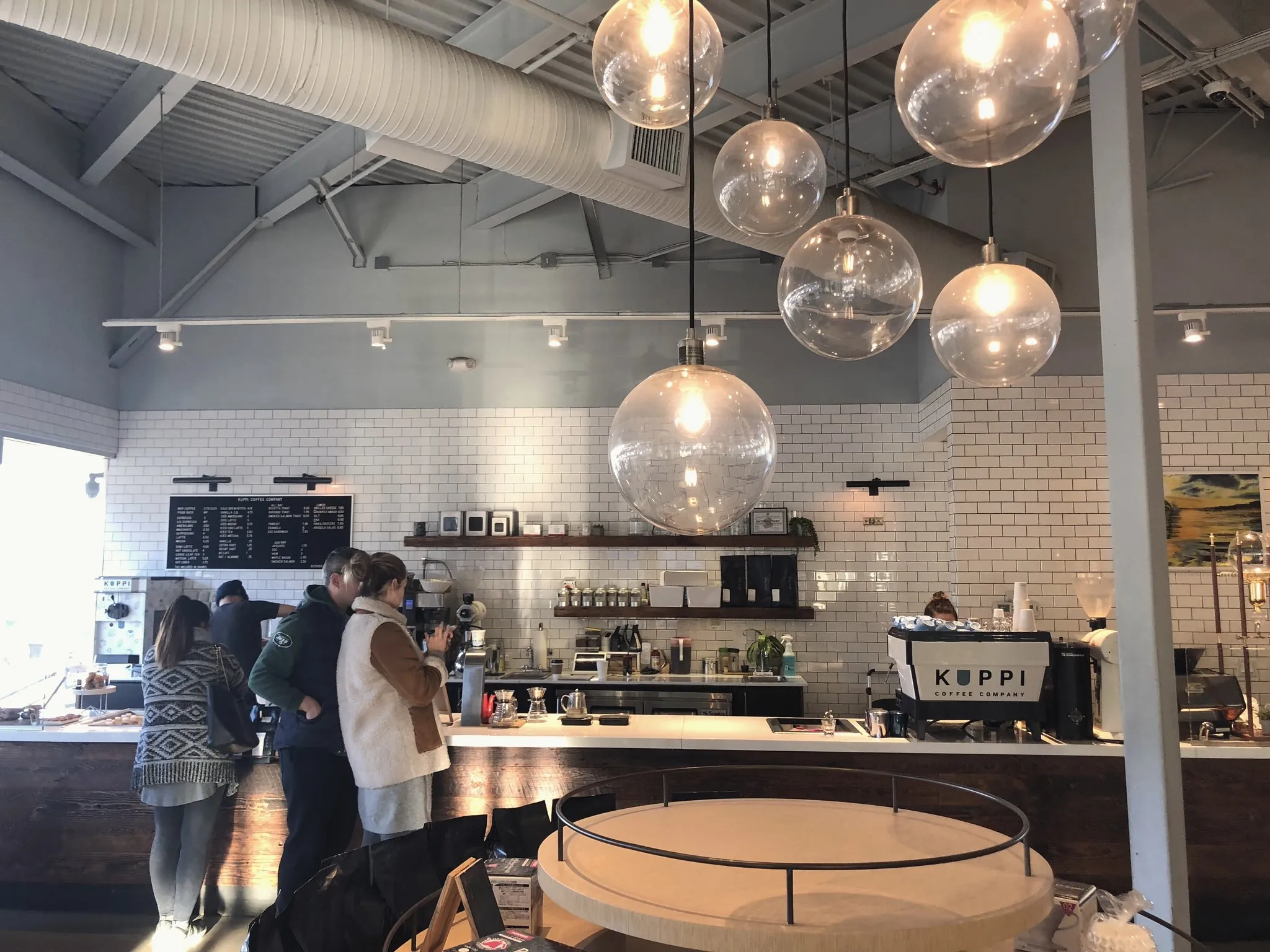 Cafe interior with pendant lights and a counter