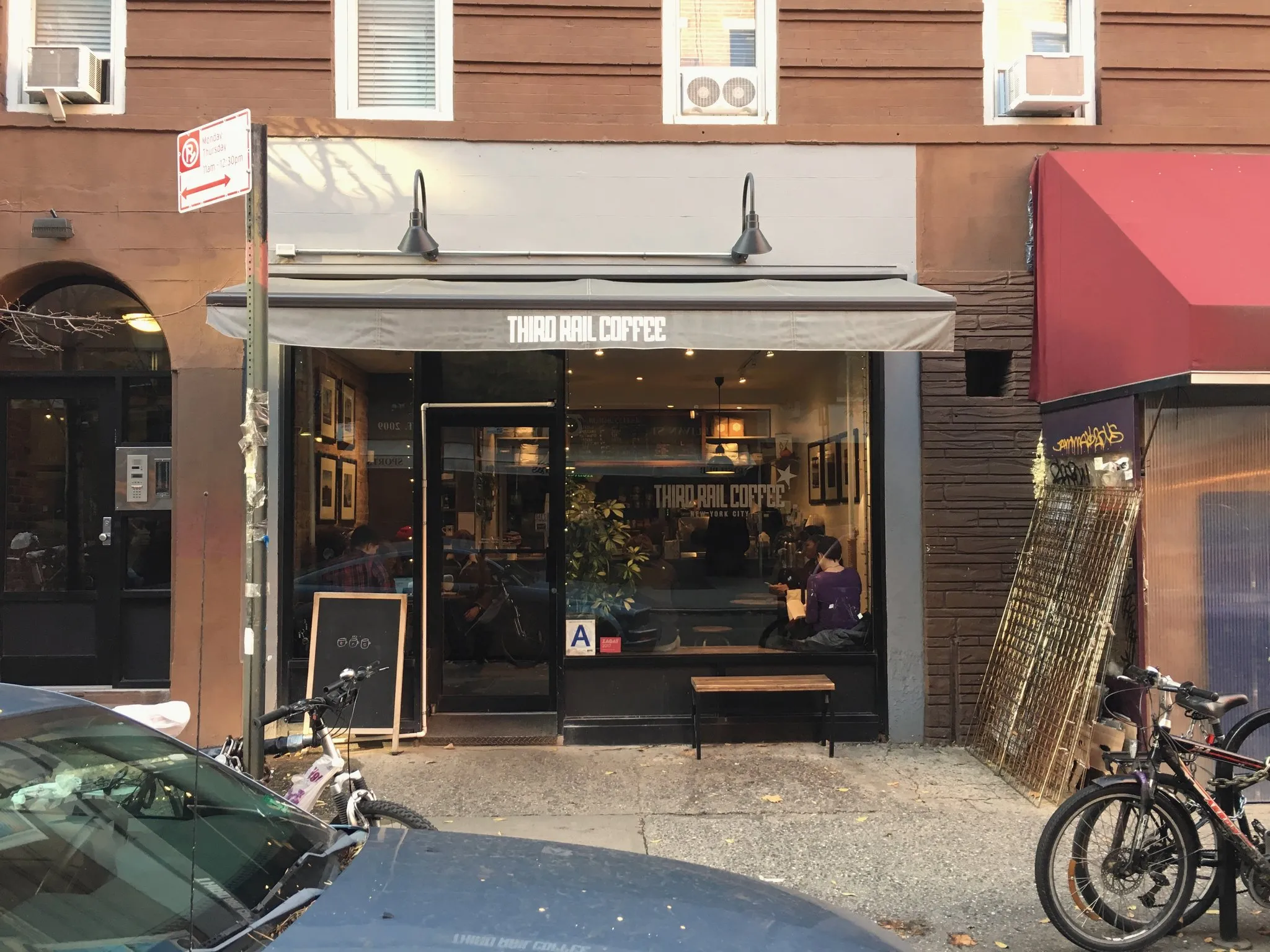 A Manhattan café storefront from the sidewalk