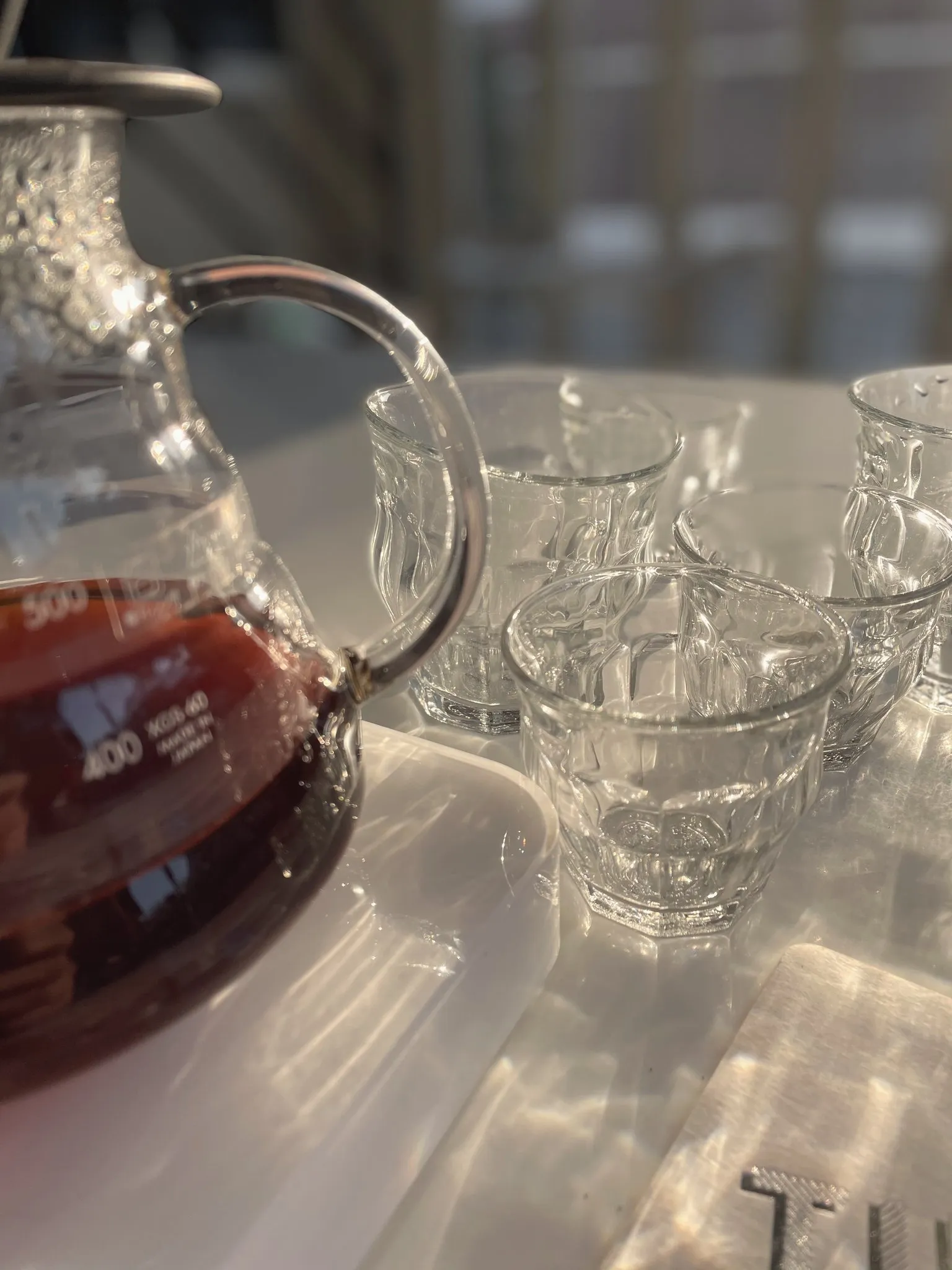 A glass carafe of freshly brewed pour over coffee